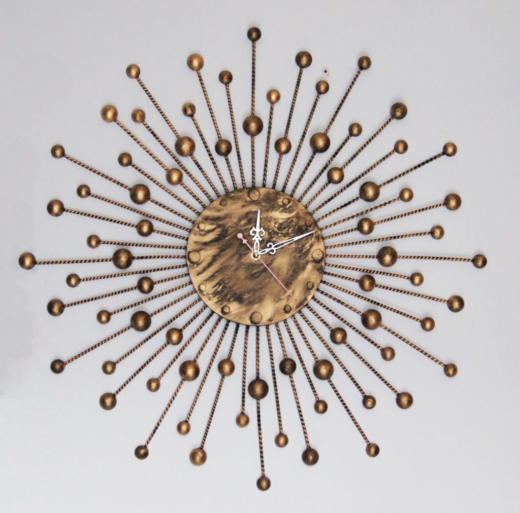 tranh-dong-ho-sat-my-thuat-hinh-mat-troi